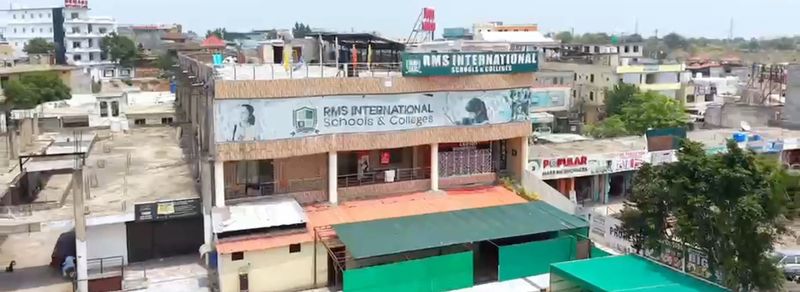 The RMS International Schools & Colleges building on its G-13 street, with the school name across the front.